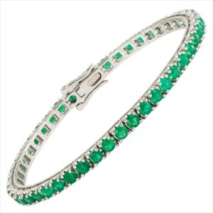 Pulseira em ouro branco com esmeraldas.