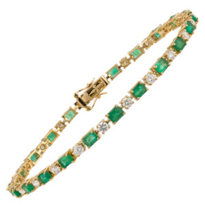 Pulseira em ouro amarelo com esmeraldas e diamantes.